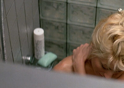 Glass block shower scene in Crocodile Dundee II (1988)