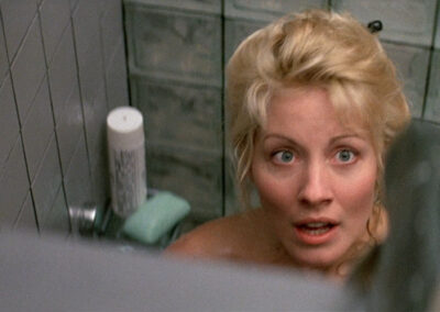 Glass block shower scene in Crocodile Dundee II (1988)