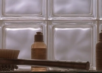 Patrick Bateman's glass block shower in American Psycho (2000)