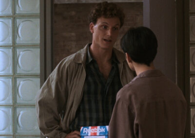 Glass block with a circle motif adorning the entrance to Sam & Molly's apartment in Ghost (1990)