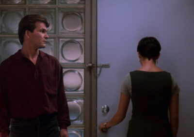 Glass block with a circle motif adorning the entrance to Sam & Molly's apartment in Ghost (1990)