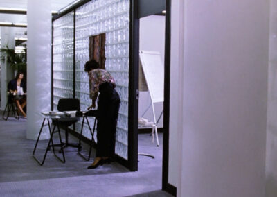 Glass block walls everywhere at the corporate offices of Beverly By Hand, in Stephen King's It (1990