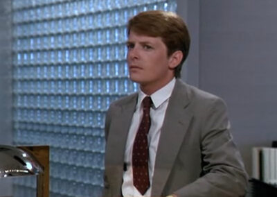 Glass block walls everywhere at Pemrose Corporation HQ in The Secret of My Success (1987)