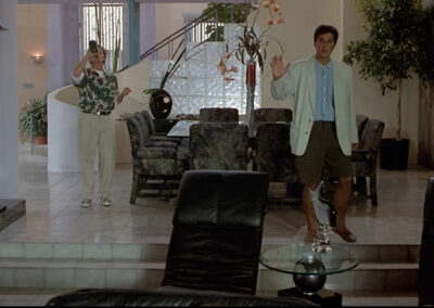 Glass block wall accents in the beach house at Weekend at Bernie's (1989)